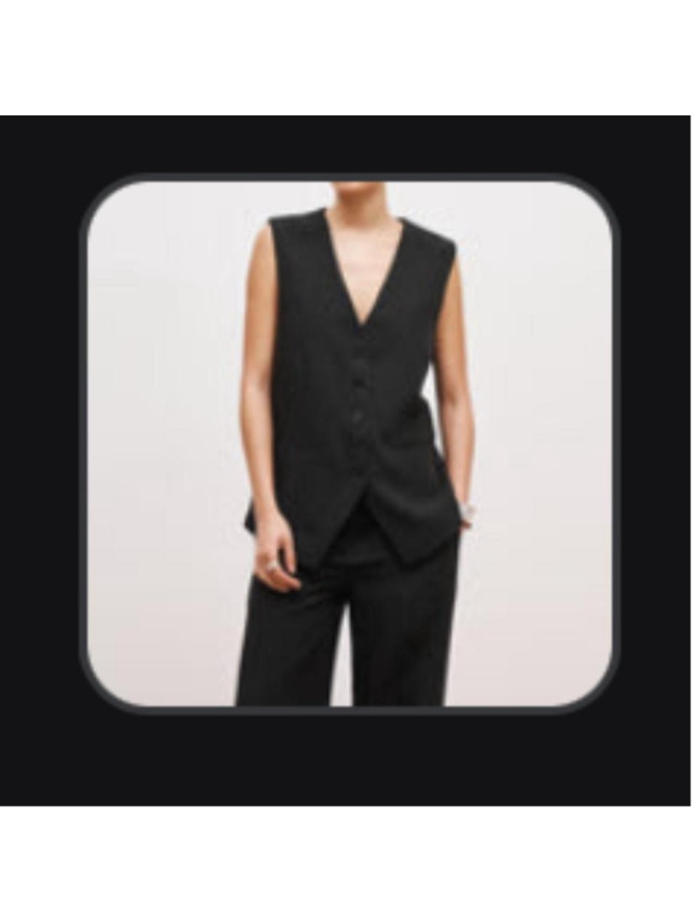 Because of Alice black oversized vest with button-up front and pockets and back